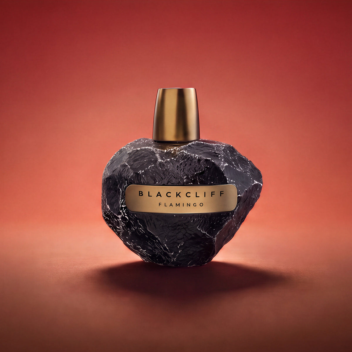 Heart-shaped perfume bottle, dark stone texture, gold cap, Flamingo label