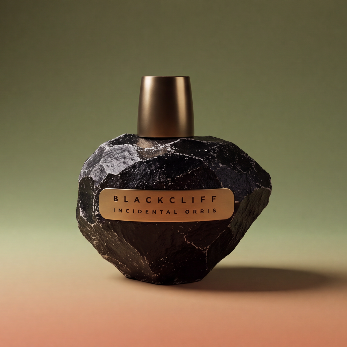 Dark stone-finish perfume bottle with gold cap and Blackcliff Incidental Orris label