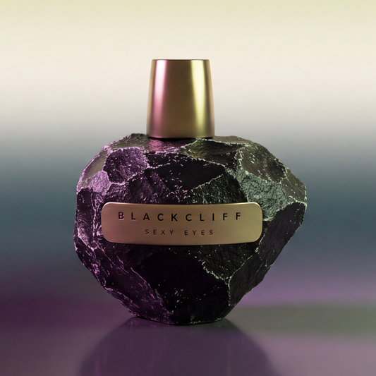 Stone-textured perfume bottle, dark purple-green with gold cap and Blackcliff Sexy Eyes label